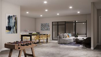 A modern resident lounge and game room at Wesley Place Apartments in Indianapolis, Indiana